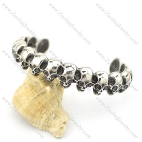 16 skull heads bangles with black stone eyes b002503