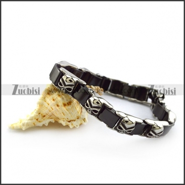 Black Ceramic Bracelet with Stainless Skulls b005607